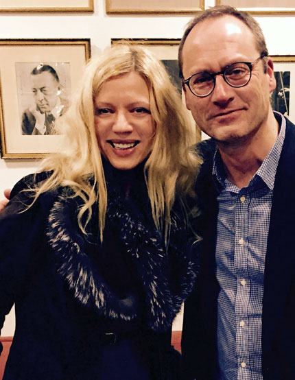 Valentina Lisitsa and Patrick Jovell in front of a portrait of Sergey Rachmaninoff at the Stockholm Concert House.